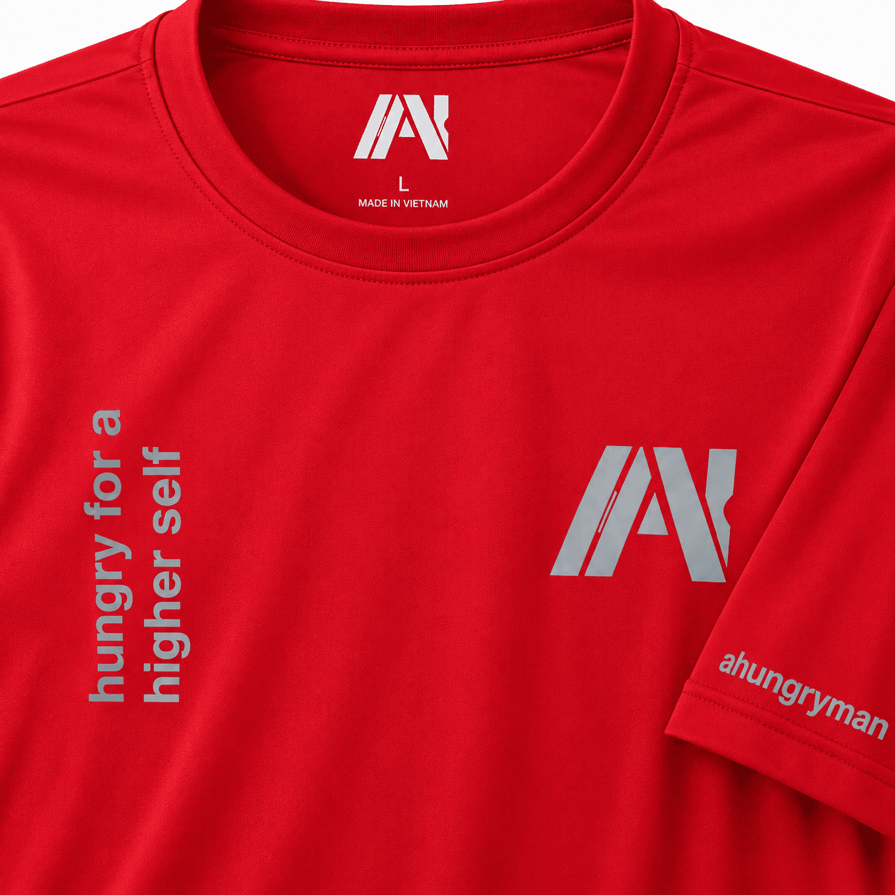 Red AHUNGRYMAN T-Shirt — close-up of chest print and neck tag